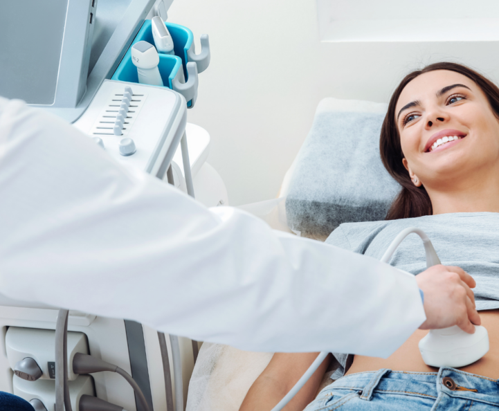 woman smiling and receiving an ultrasound